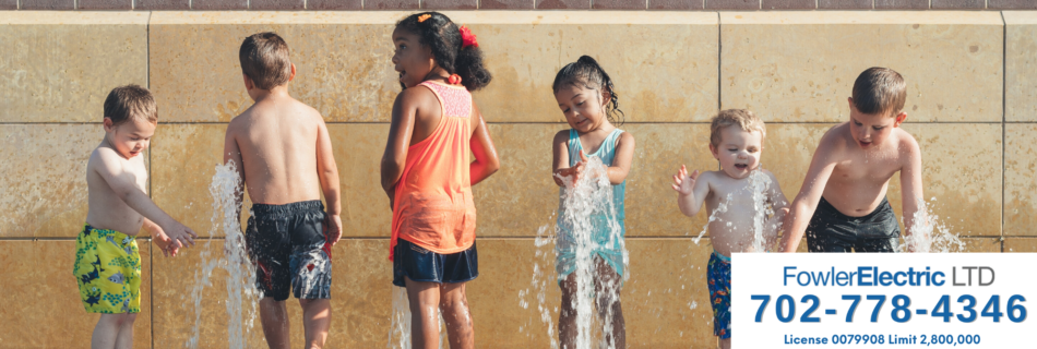 kids playing at splash pad feature image for electrical safety tips for summer