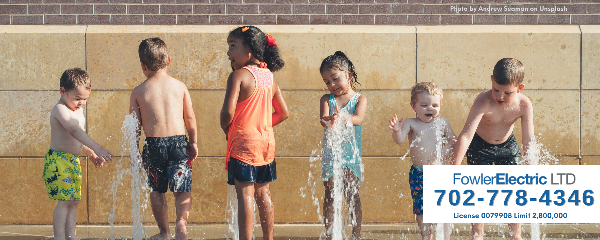 kids playing at splash pad feature image for electrical safety tips for summer
